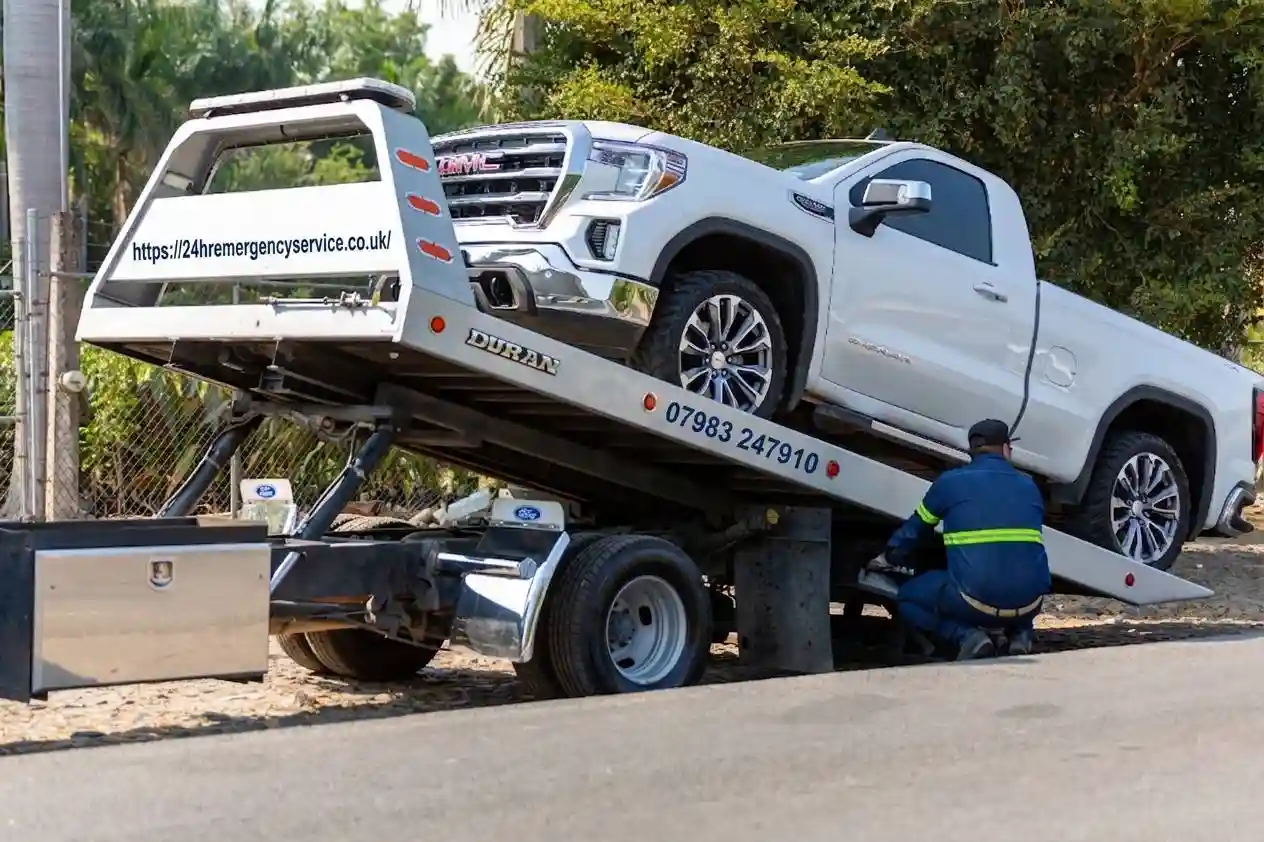24hr Nationwide Recovery service truck loading a vehicle roadside